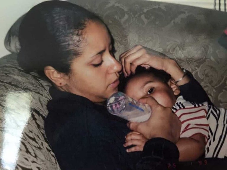 Laurie feeding her then-young son Julian Broadus 